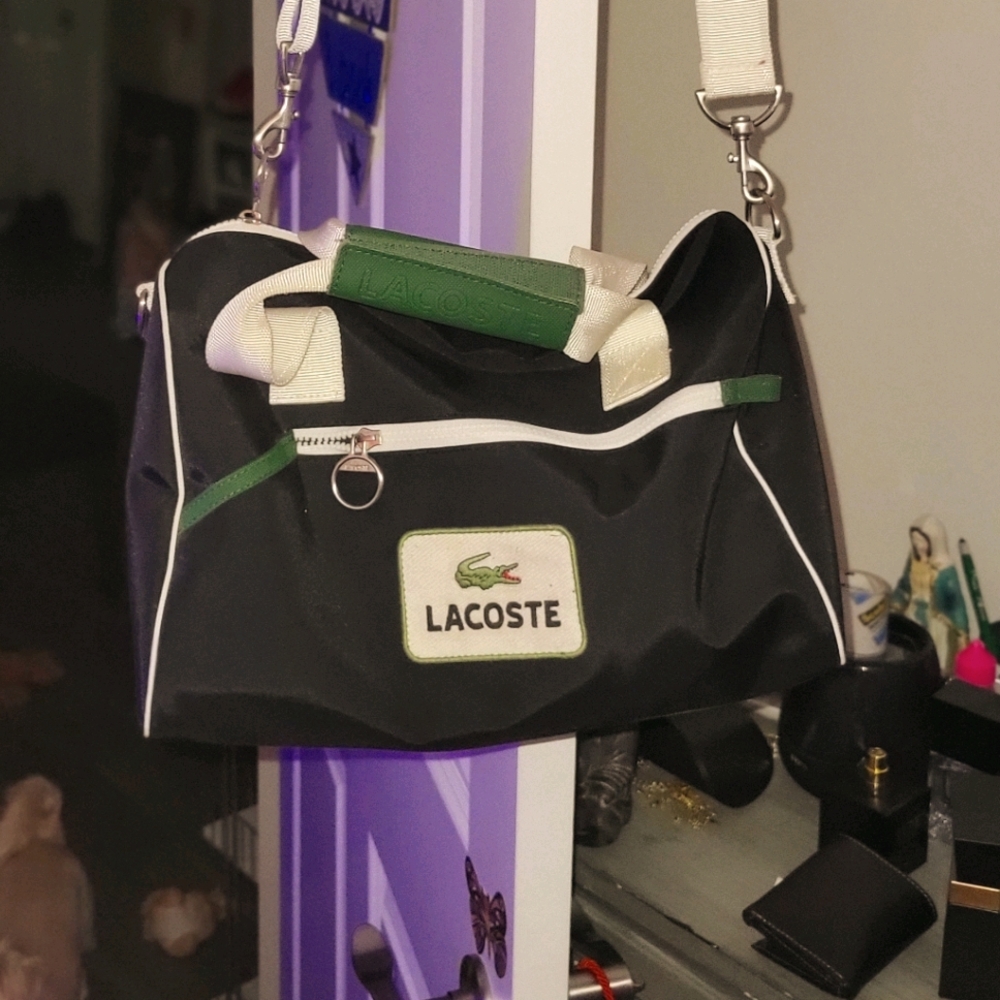 Lacoste small duffle with a bonus t, a top quality t shirt with a screen print u